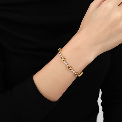 gold om bracelet