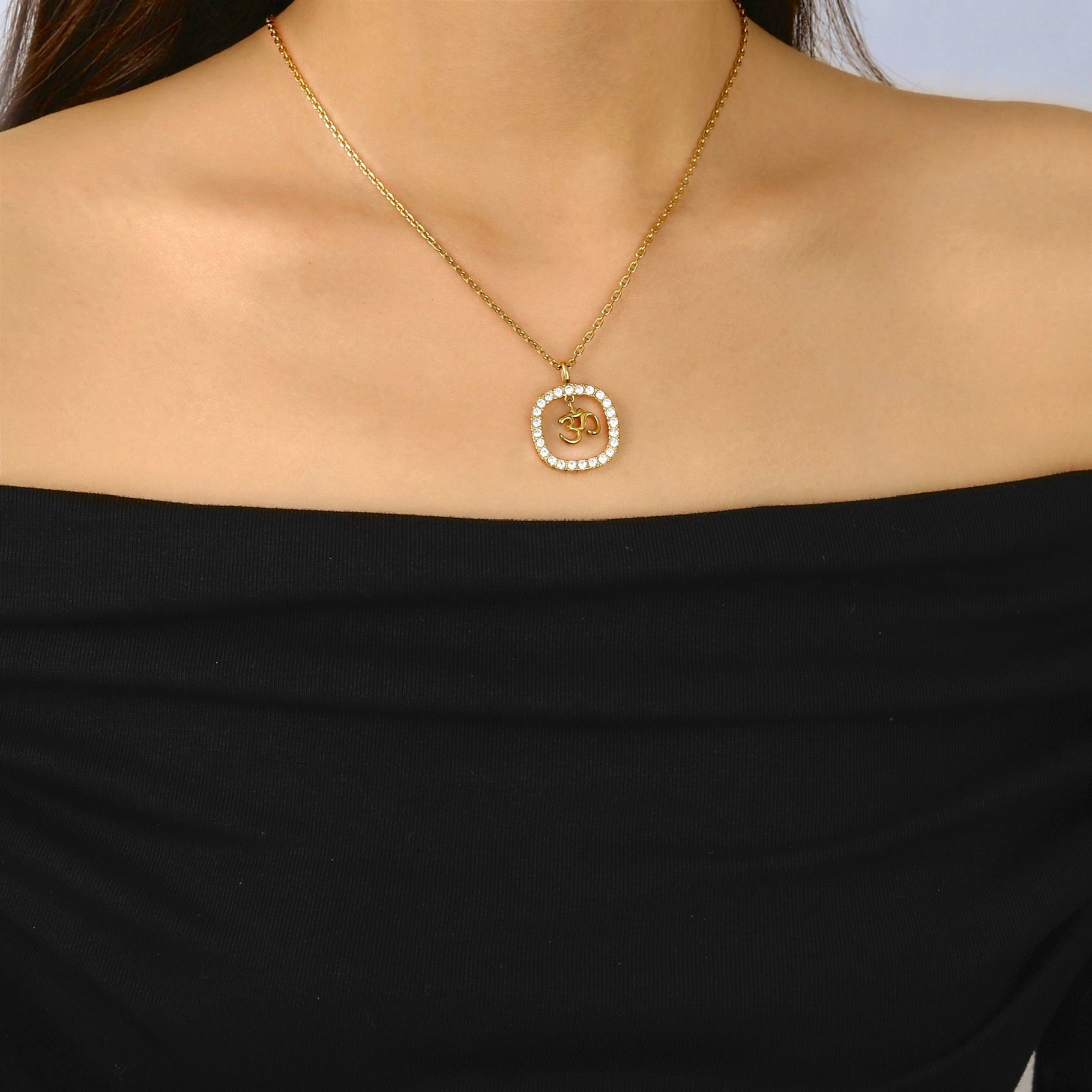 gold om pendant