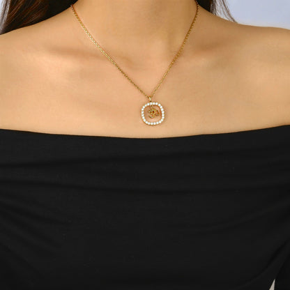 gold om pendant