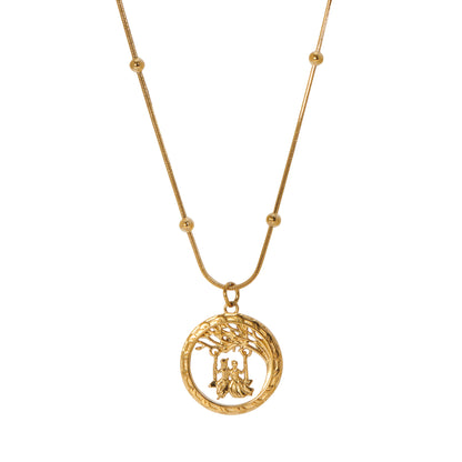 A gold-colored Radha Krishna swing necklace with a beaded snake chain design, featuring an engraved pendant of the two figures in a playful swinging pose.