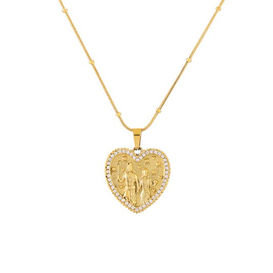 Gold heart-shaped pendant necklace on a white background
