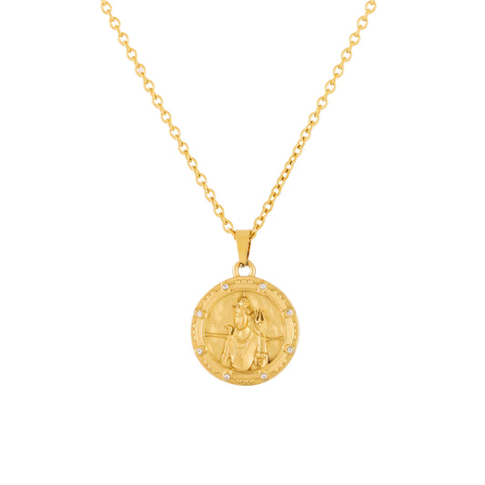 Gold shiva necklace with a round pendant on a white background