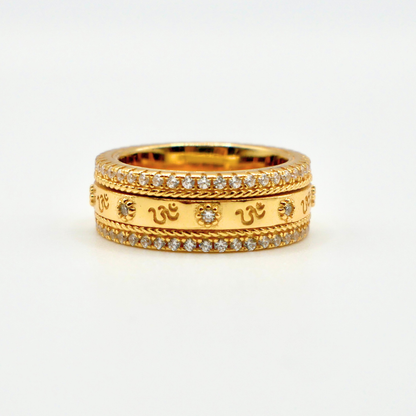 Gold ring with diamond accents on a white background