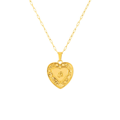 Gold heart-shaped om pendant necklace on a white background